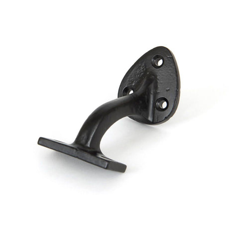 This is an image showing From The Anvil - Black 2" Handrail Bracket available from T.H Wiggans Architectural Ironmongery in Kendal, quick delivery and discounted prices