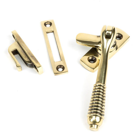 This is an image showing From The Anvil - Aged Brass Locking Reeded Fastener available from T.H Wiggans Architectural Ironmongery in Kendal, quick delivery and discounted prices
