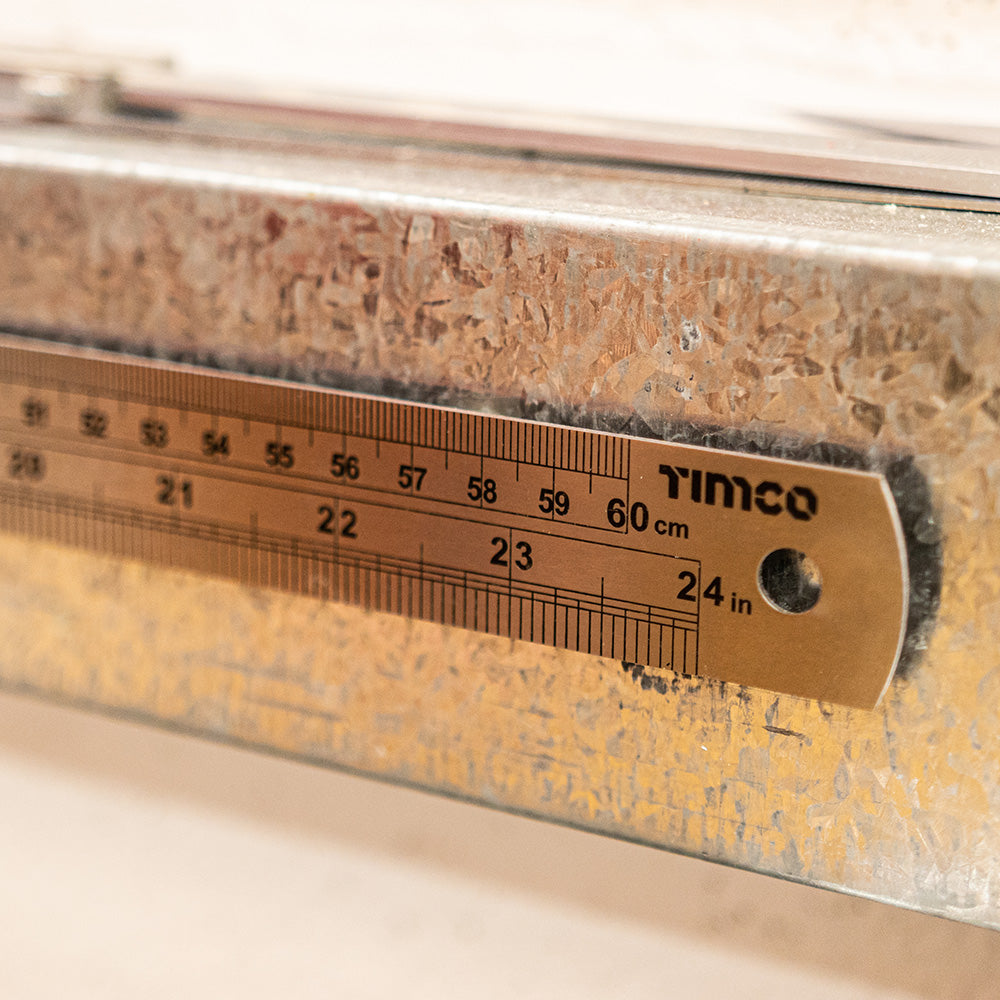 This is an image showing TIMCO Steel Ruler - 600mm - 1 Each Wallet available from T.H Wiggans Ironmongery in Kendal, quick delivery at discounted prices.