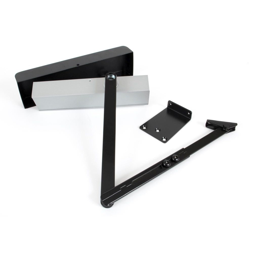 This is an image showing From The Anvil - Black Size 2-5 Door Closer & Cover available from trade door handles, quick delivery and discounted prices