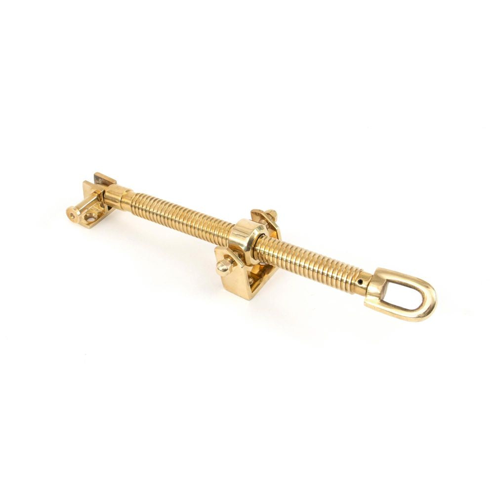 This is an image showing From The Anvil - Polished Brass 12" Fanlight Screw Opener available from T.H Wiggans Architectural Ironmongery in Kendal, quick delivery and discounted prices