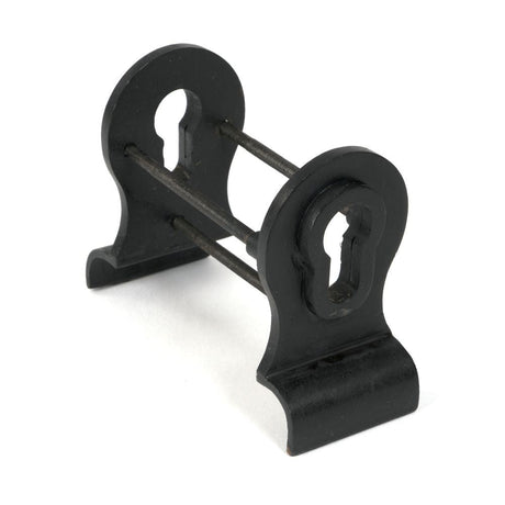 This is an image of From The Anvil - External Beeswax 50mm Euro Door Pull (Back to Back fixings) available to order from T.H Wiggans Architectural Ironmongery in Kendal, quick delivery and discounted prices.
