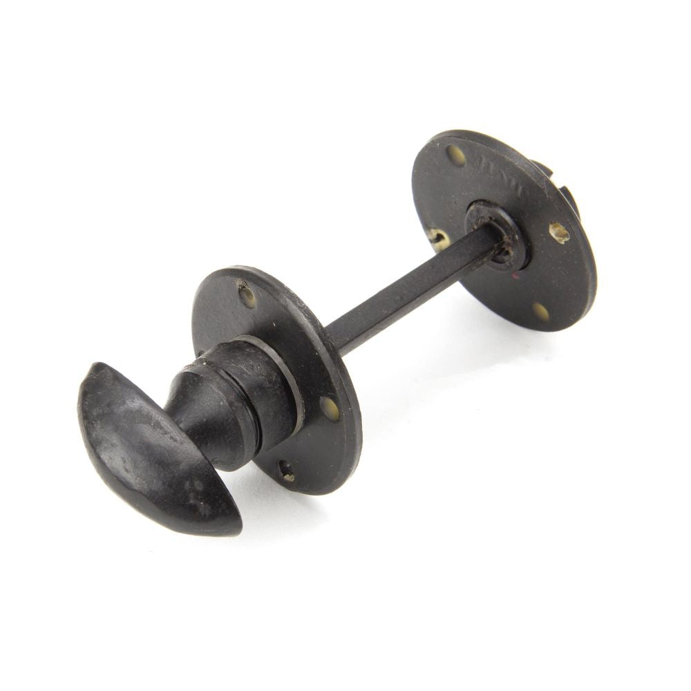 This is an image of From The Anvil - External Beeswax Round Bathroom Thumbturn available to order from T.H Wiggans Architectural Ironmongery in Kendal, quick delivery and discounted prices.