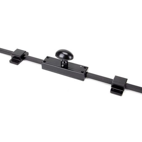 This is an image showing From The Anvil - Black Cremone Bolt available from T.H Wiggans Architectural Ironmongery in Kendal, quick delivery and discounted prices