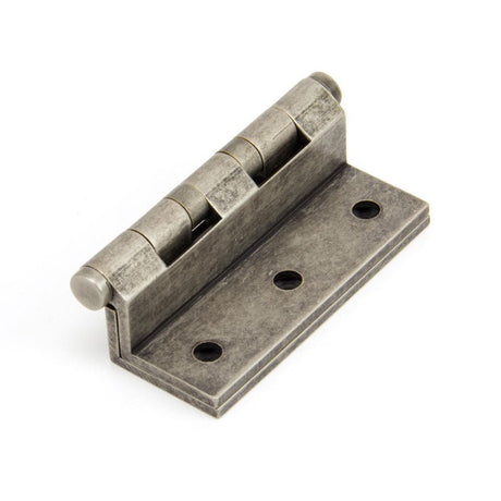 This is an image showing From The Anvil - Antique Pewter 2 1/2" Stormproof Hinge 1951 (pair) available from T.H Wiggans Architectural Ironmongery, quick delivery and discounted prices