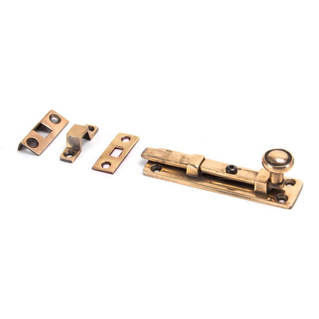 This is an image showing From The Anvil - Polished Bronze 4" Universal Bolt available from T.H Wiggans Architectural Ironmongery in Kendal, quick delivery and discounted prices