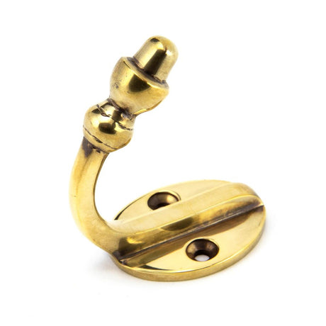 This is an image showing From The Anvil - Aged Brass Coat Hook available from T.H Wiggans Architectural Ironmongery in Kendal, quick delivery and discounted prices