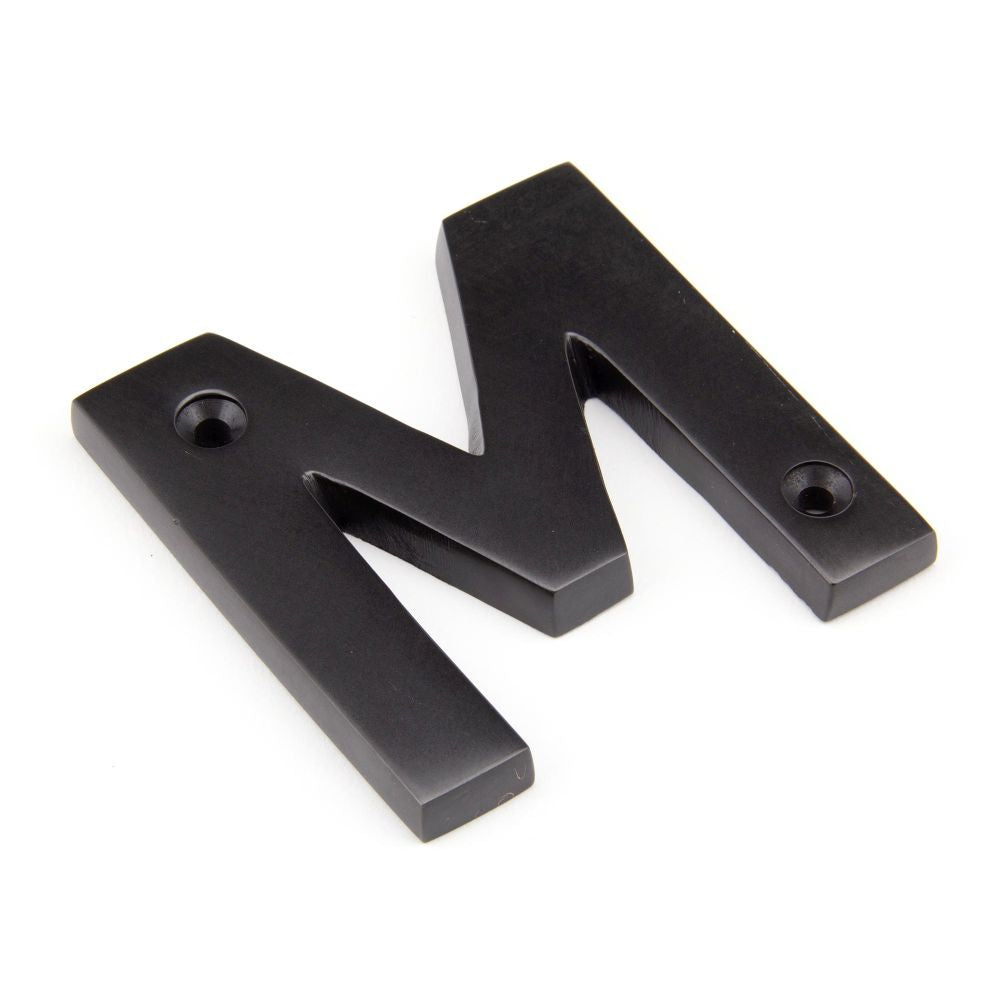 This is an image of From The Anvil - Aged Bronze Letter M available to order from T.H Wiggans Architectural Ironmongery in Kendal, quick delivery and discounted prices.