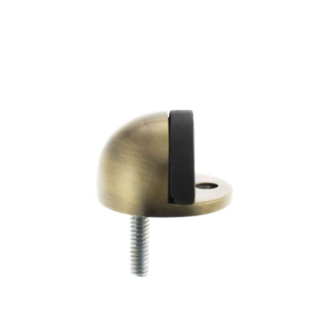 This is an image of Atlantic Half-Moon Premium Floor Mounted Door Stop - Antique Brass available to order from T.H Wiggans Architectural Ironmongery in Kendal, quick delivery and discounted prices.