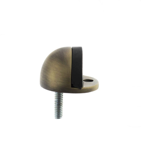 This is an image of Atlantic Half-Moon Premium Floor Mounted Door Stop - Matt Antique Brass available to order from T.H Wiggans Architectural Ironmongery in Kendal, quick delivery and discounted prices.