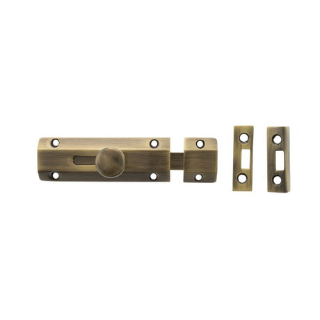 This is an image of Atlantic Solid Brass Surface Door Bolt 4" - Ant. Brass available to order from T.H Wiggans Architectural Ironmongery in Kendal.