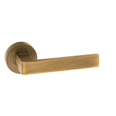This is an image of Forme Asti Designer Lever on Minimal Round Rose - Yester Bronze available to order from T.H Wiggans Architectural Ironmongery in Kendal, quick delivery and discounted prices.