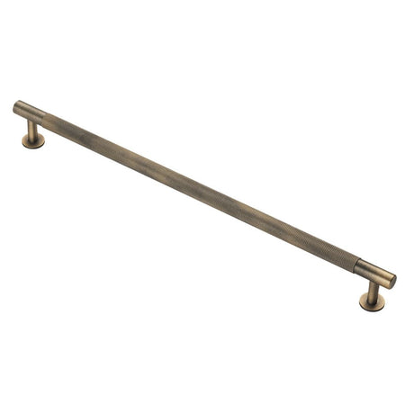 This is an image of a FTD - Knurled Pull Handle 320mm c/c - Antique Brass that is availble to order from T.H Wiggans Architectural Ironmongery in Kendal in Kendal.