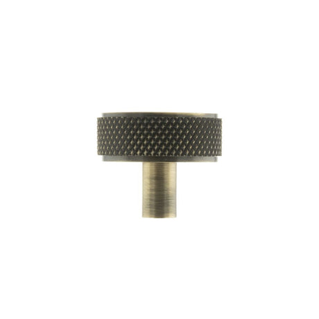 This is an image of Millhouse Brass Hargreaves Disc Knurled Cabinet Knob Concealed Fix - Ant. Brass available to order from T.H Wiggans Architectural Ironmongery in Kendal.