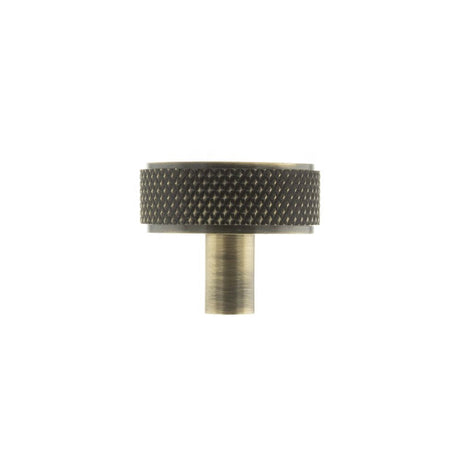 This is an image of Millhouse Brass Hargreaves Disc Knurled Cabinet Knob Concealed Fix - Ant. Brass available to order from Trade Door Handles.