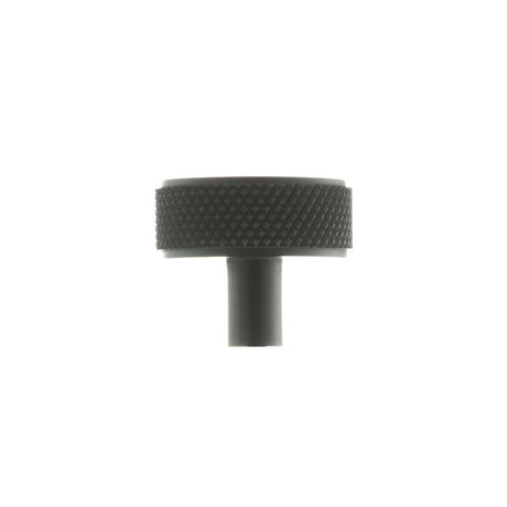 This is an image of Millhouse Brass Hargreaves Disc Knurled Cabinet Knob Concealed Fix - Matt Black available to order from Trade Door Handles.