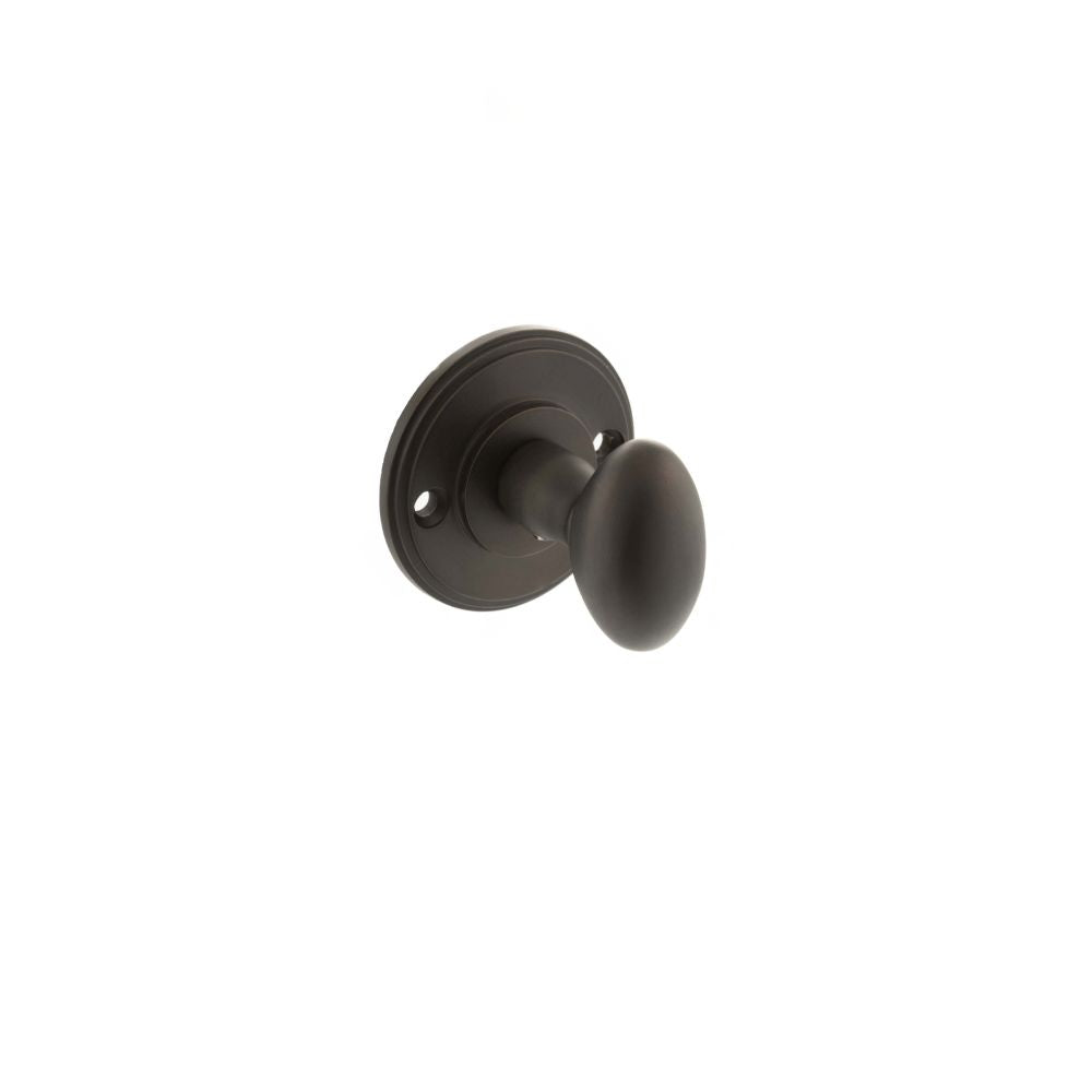This is an image of Millhouse Brass Solid Brass Oval WC Turn and Release - Urban Dark Bronze available to order from Trade Door Handles.