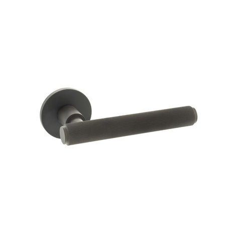 This is an image of Millhouse Brass Stephenson Designer Lever on 5mm Slimline Round Rose - Urban Dar available to order from T.H Wiggans Architectural Ironmongery in Kendal, quick delivery and discounted prices.