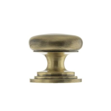 This is an image of Old English Lincoln Solid Brass Cabinet Knob 38mm Concealed Fix - Ant. Brass available to order from T.H Wiggans Architectural Ironmongery in Kendal.