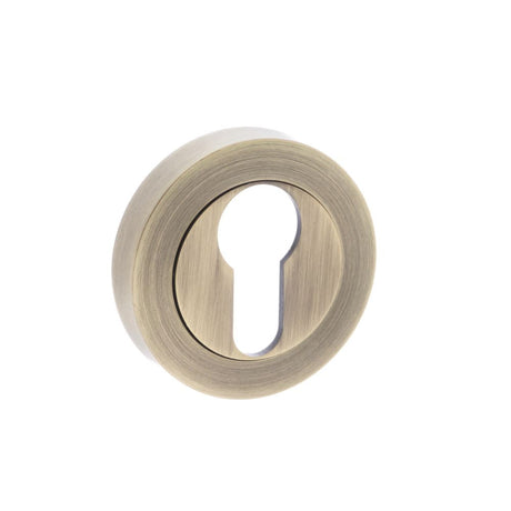 This is an image of Old English Euro Escutcheon - Matt Antique Brass available to order from T.H Wiggans Architectural Ironmongery in Kendal, quick delivery and discounted prices.