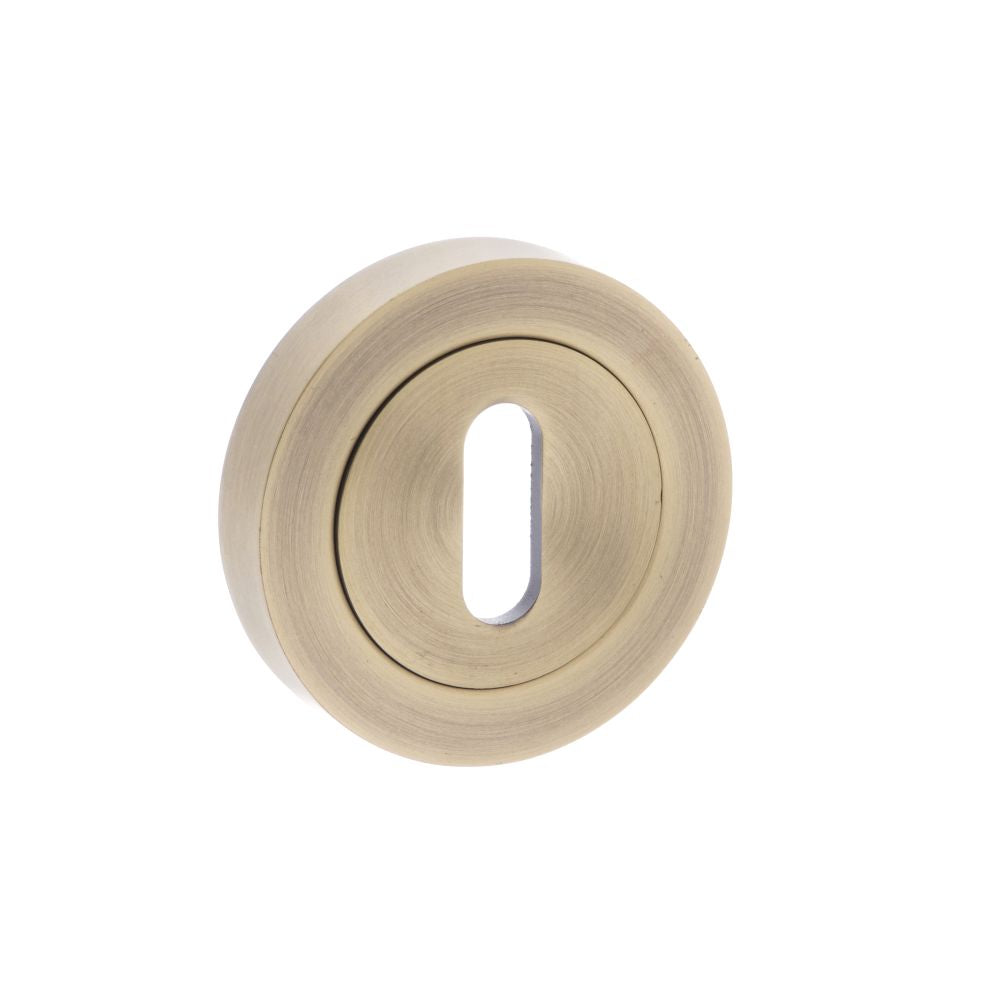 This is an image of Old English Key Escutcheon - Matt Antique Brass available to order from T.H Wiggans Architectural Ironmongery in Kendal, quick delivery and discounted prices.