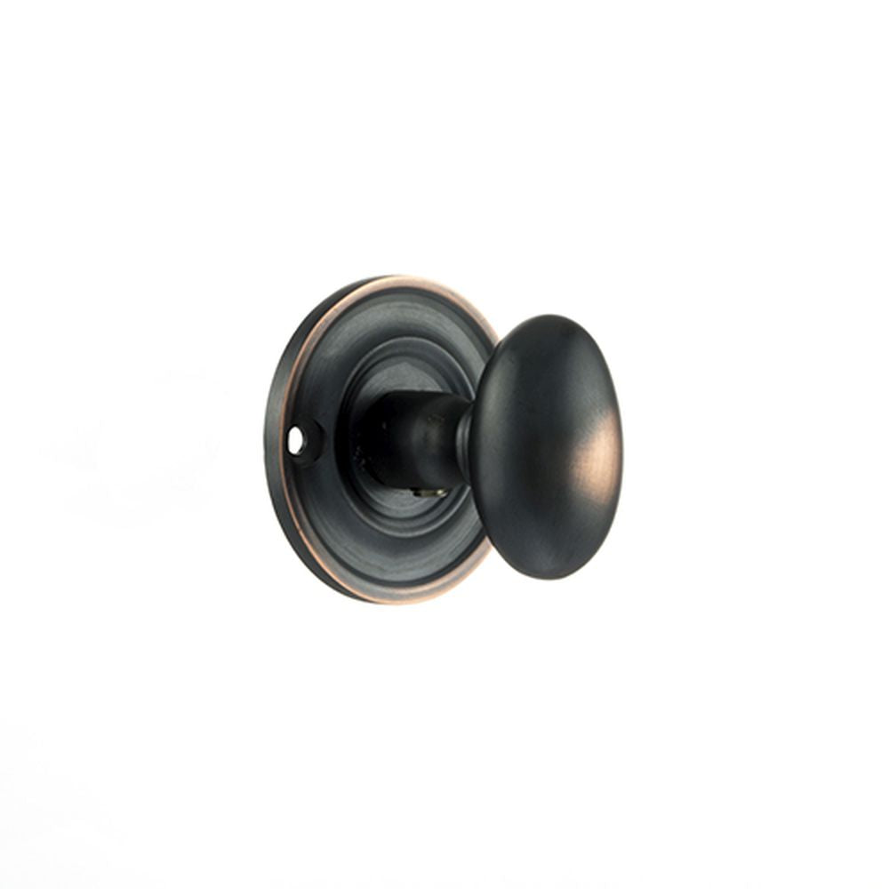 This is an image of Old English Solid Brass Oval WC Turn and Release - Antique Copper available to order from T.H Wiggans Architectural Ironmongery in Kendal, quick delivery and discounted prices.