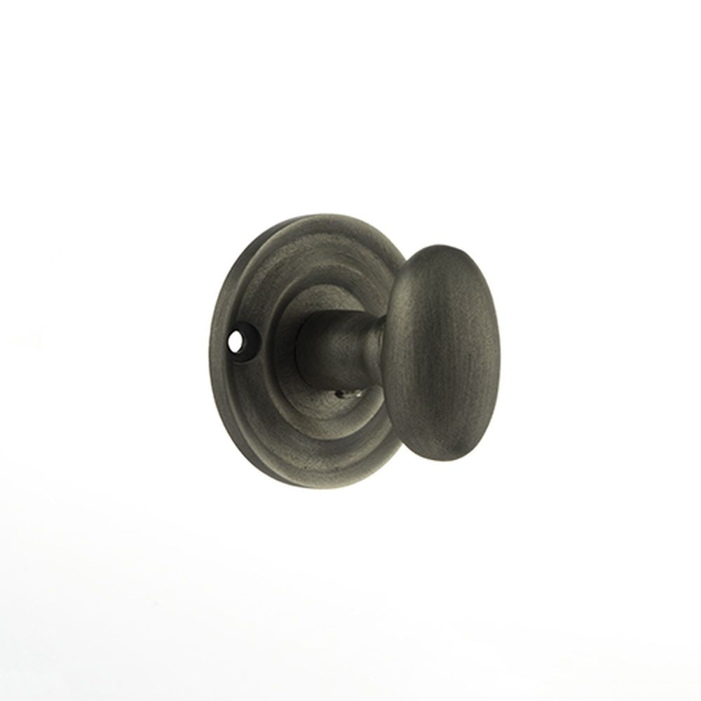 This is an image of Old English Solid Brass Oval WC Turn and Release - Matt Gun Metal available to order from T.H Wiggans Architectural Ironmongery in Kendal, quick delivery and discounted prices.