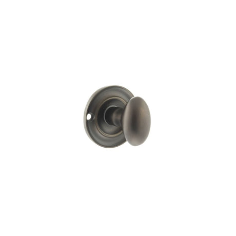This is an image of Old English Solid Brass Oval WC Turn and Release - Urban Dark Bronze available to order from T.H Wiggans Architectural Ironmongery in Kendal, quick delivery and discounted prices.