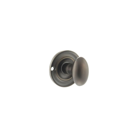 This is an image of Old English Solid Brass Oval WC Turn and Release - Urban Dark Bronze available to order from Trade Door Handles.