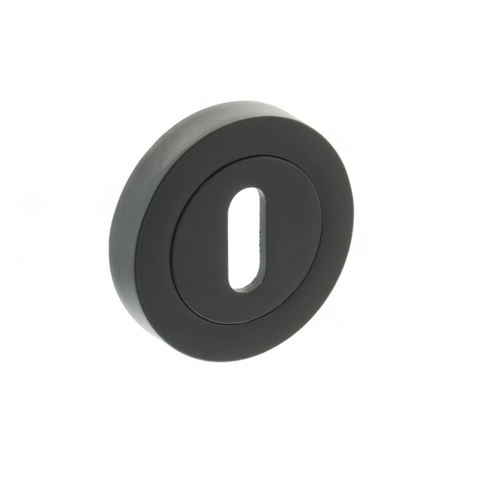 This is an image of STATUS Key Escutcheon on Round Rose - Matt Black available to order from T.H Wiggans Architectural Ironmongery in Kendal, quick delivery and discounted prices.