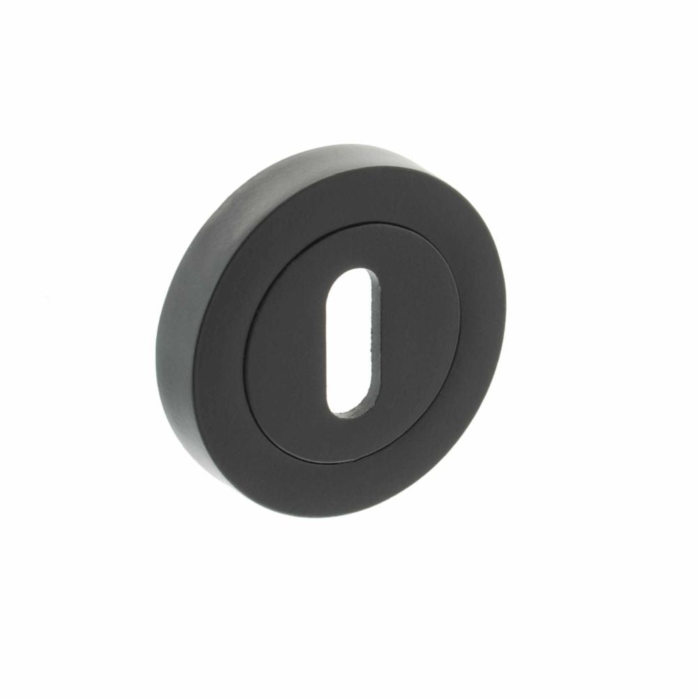 This is an image of STATUS Key Escutcheon on Round Rose - Matt Black available to order from Trade Door Handles.