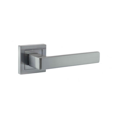 This is an image of STATUS Montana Designer Lever on S4 Square Rose - Satin Chrome available to order from T.H Wiggans Architectural Ironmongery in Kendal, quick delivery and discounted prices.