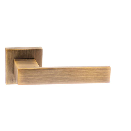 This is an image of Senza Pari Panetti Designer Lever on Flush Square Rose - Weathered Antique Bronz available to order from T.H Wiggans Architectural Ironmongery in Kendal, quick delivery and discounted prices.