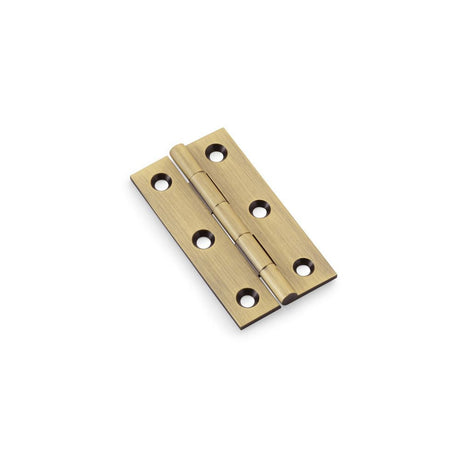 This is an image showing Alexander & Wilks Heavy Pattern Solid Brass Cabinet Butt Hinge - Antique Brass - 2.5" aw064-ch-ab available to order from T.H Wiggans Ironmongery in Kendal, quick delivery and discounted prices.