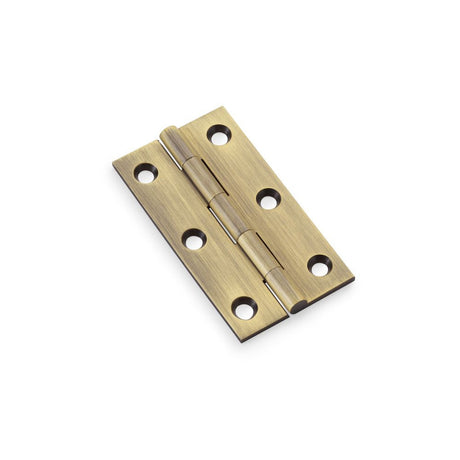 This is an image showing Alexander & Wilks Heavy Pattern Solid Brass Cabinet Butt Hinge - Antique Brass - 3" aw075-ch-ab available to order from T.H Wiggans Ironmongery in Kendal, quick delivery and discounted prices.