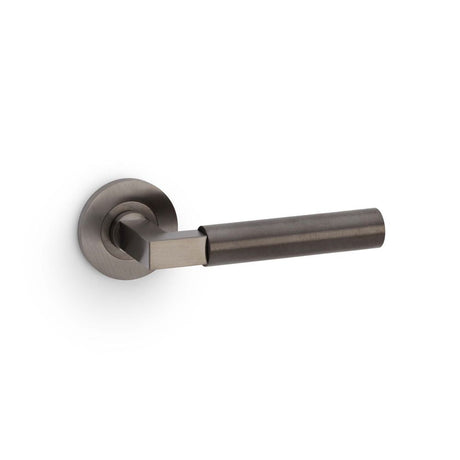 This is an image showing Alexander & Wilks Hurricane Plain Lever on Round Rose - Dark Bronze PVD aw201dbzpvd available to order from T.H Wiggans Ironmongery in Kendal, quick delivery and discounted prices.