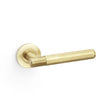 This is an image showing Alexander & Wilks Spitfire Knurled Lever on Round Rose - Satin Brass PVD aw220sbpvd available to order from T.H Wiggans Ironmongery in Kendal, quick delivery and discounted prices.