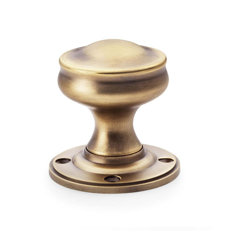 This is an image showing Alexander & Wilks Harris Door Knob - Antique Brass aw301-50-ab available to order from T.H Wiggans Ironmongery in Kendal, quick delivery and discounted prices.