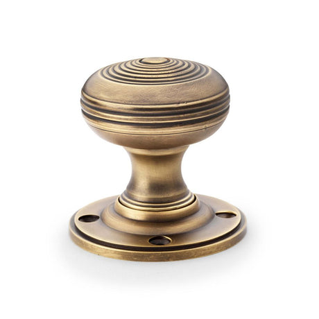 This is an image showing Alexander & Wilks Christoph Mortice Knob - Antique Brass aw303-50-ab available to order from T.H Wiggans Ironmongery in Kendal, quick delivery and discounted prices.