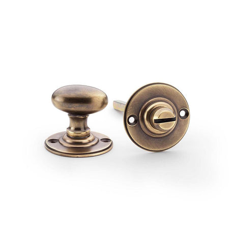This is an image showing Alexander & Wilks Thumbturn and Release - Antique Brass aw386-ab available to order from T.H Wiggans Ironmongery in Kendal, quick delivery and discounted prices.