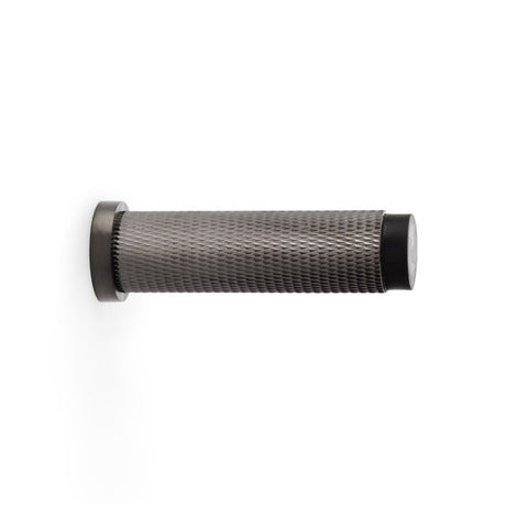 This is an image showing Alexander & Wilks Brunel Knurled Door Stop - Dark Bronze PVD aw600-75-dbzpvd available to order from T.H Wiggans Ironmongery in Kendal, quick delivery and discounted prices.