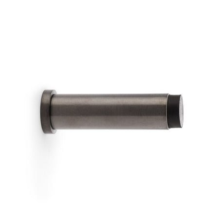 This is an image showing Alexander & Wilks Plain Projection Cylinder Door Stop - Dark Bronze PVD aw601-75-dbzpvd available to order from T.H Wiggans Ironmongery in Kendal, quick delivery and discounted prices.