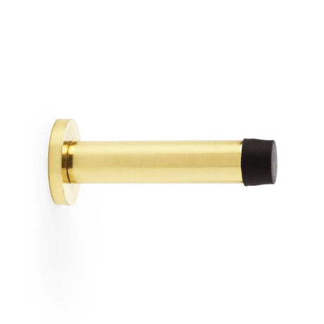 This is an image showing Alexander & Wilks Cylinder Projection Door Stop on Rose - Polished Brass Lacquered aw616pbl available to order from T.H Wiggans Ironmongery in Kendal, quick delivery and discounted prices.