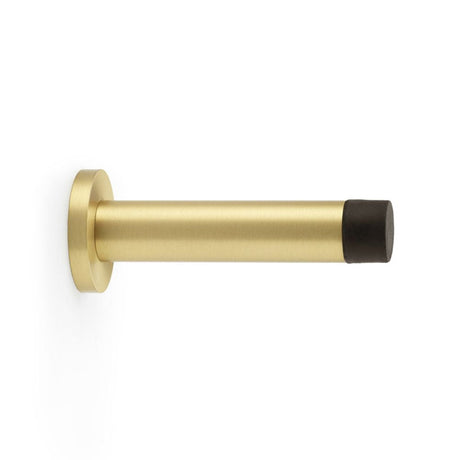This is an image showing Alexander & Wilks Cylinder Projection Door Stop on Rose - Satin Brass aw616sb available to order from T.H Wiggans Ironmongery in Kendal, quick delivery and discounted prices.