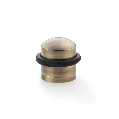This is an image showing Alexander & Wilks Dome Top Floor Mounted Door Stop - Antique Bronze aw638abz available to order from T.H Wiggans Ironmongery in Kendal, quick delivery and discounted prices.