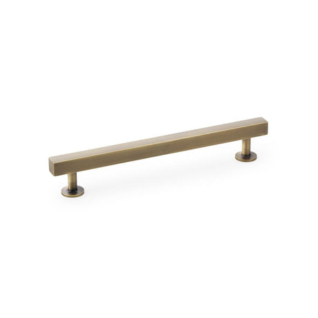 This is an image showing Alexander & Wilks Square T-Bar Cabinet Pull Handle - Antique Brass - Centres 160mm aw815-160-ab available to order from T.H Wiggans Ironmongery in Kendal, quick delivery and discounted prices.