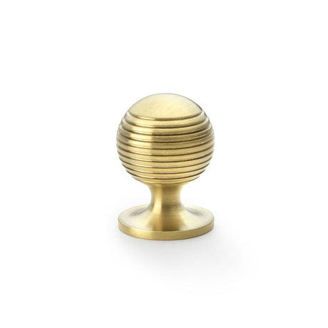 This is an image showing Alexander & Wilks Caesar Cupboard Knob on Round Rose - Satin Brass PVD - 32mm aw832-32-sbpvd available to order from T.H Wiggans Ironmongery in Kendal, quick delivery and discounted prices.