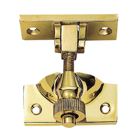 This is an image of a Carlisle Brass - Brighton Pattern Sash Fastener - Polished Brass that is availble to order from T.H Wiggans Architectural Ironmongery in Kendal in Kendal.