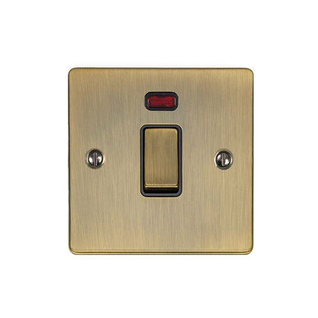This is an image showing Eurolite Enhance Decorative 20Amp Switch with Neon Indicator - Antique Brass (With Black Trim) en20aswnabb available to order from T.H. Wiggans Ironmongery in Kendal, quick delivery and discounted prices.