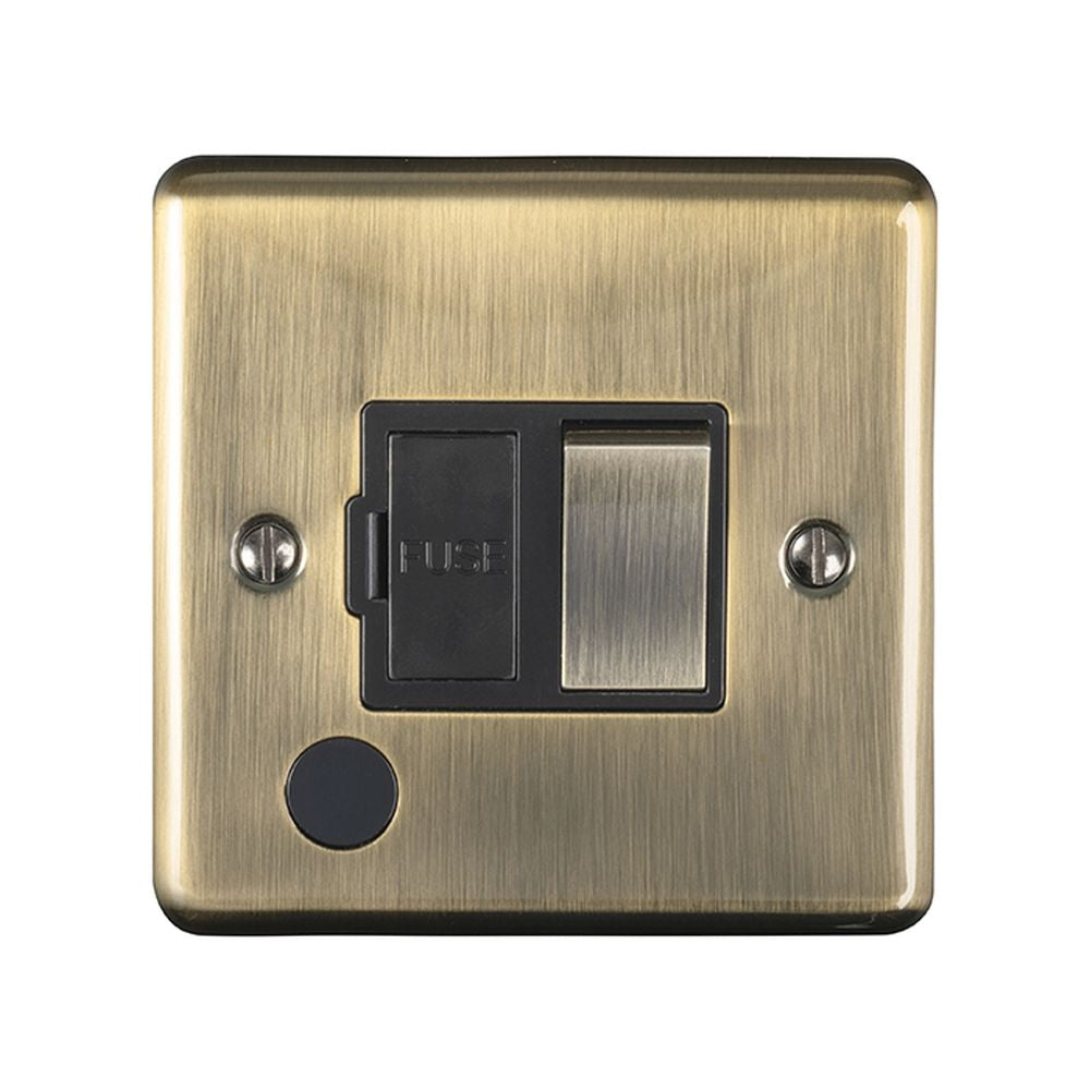 This is an image showing Eurolite Enhance Decorative Switched Fuse Spur With Flex Outlet - Antique Brass (With Black Trim) enswffoabb available to order from T.H. Wiggans Ironmongery in Kendal, quick delivery and discounted prices.